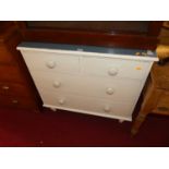 A Victorian pine, later white painted and laminate topped low chest of two short over two long