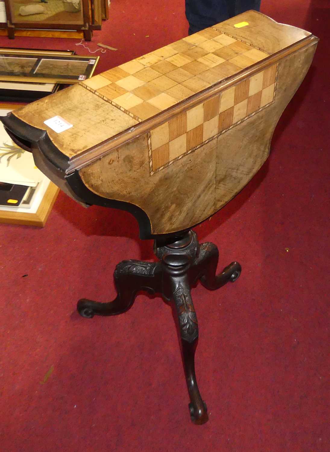 A mid-Victorian figured walnut and inlaid chessboard topped dropflap pedestal occasional games