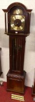 A contemporary mahogany Tempus Fugit grandmother clock, having a glazed trunk door, with triple