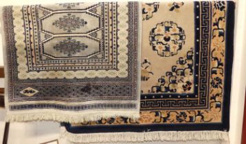 A Chinese woollen Superwash blue and pale ground rug, 185 x 120cm; together with a Persian woollen