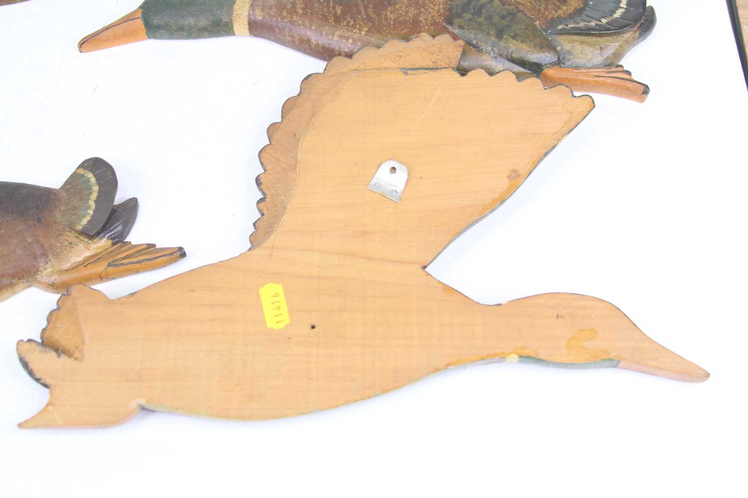 A set of four carved and painted pine wall plaques, each in the form of a flying duck One has been - Image 3 of 3