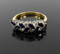 An 18ct gold sapphire and diamond half hoop ring arranged as alternating round brilliant cut