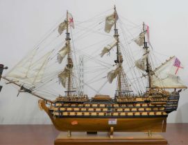 A wooden model of HMS Victory, on stand, height 56cm