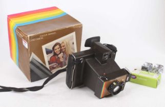 A boxed Polaroid colour Swinger land camera