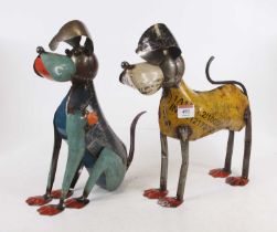 A painted metal novelty dog, in standing pose, h.30cm; together with another in seated pose (2)