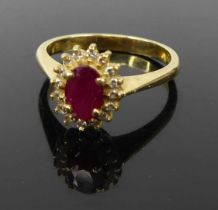 A contemporary 18ct gold ruby and diamond highlight set dress ring, 5.2g, size R