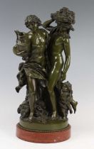 After Clodion (1738-1840) - a bronze Bacchanalian group, green patina, modelled as a youth and a