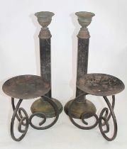 A pair of verdigris metal mounted polished hardstone table candlesticks, height 47cm, together
