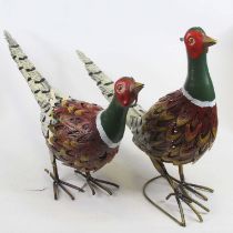 A pair of modern painted pressed metal models of pheasants, height of largest 40cm