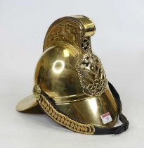 A reproduction brass fireman's helmet, height 27cm