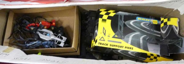 A collection of mixed slot car racing track and vehicles to include Scalextric