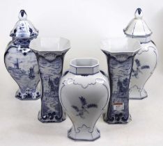 A pair of 20th century Delft blue and white trumpet vases, each h.24cm; together with a set of three