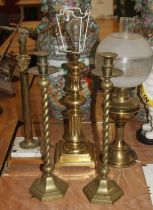 A pair of brass barleytwist table candlesticks, each h.48cm; together with three brass table