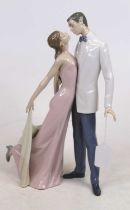 A Lladro porcelain figure group of a young couple, h.32cm Appear in good condition, free from