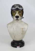 A painted composite head & shoulders bust of a dog dressed as a racing driver, height 50cm