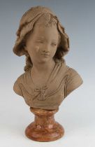 After Jean-Antoine Houdon (1741-1828), a terracotta head and shoulders portrait bust of a young