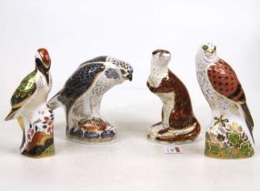 A Royal Crown Derby model of a playful otter, h.16cm; together with an osprey, green woodpecker, and