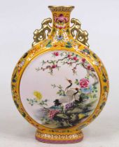 A Chinese porcelain moon vase, decorated with birds amongst flowers, h.26cm