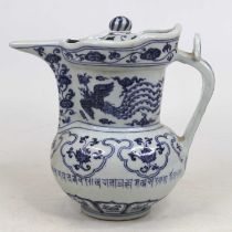 A Chinese blue and white porcelain ewer, decorated with a phoenix and lotus, h.22cm Of recent