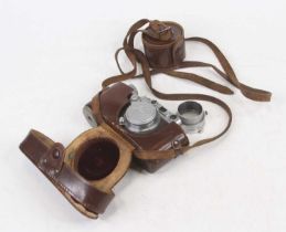 A Leica No. 121897 Ernst Leitz Wetzlar DRP 35mm camera, in leather case Does not wind on.There is