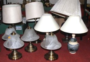 A collection of nine various modern table lamps