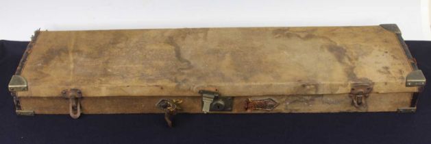 A late Victorian canvas and brass bound shotgun case with trade label to the underside of the