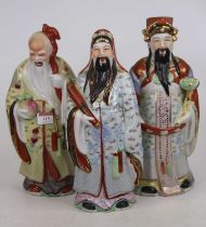 A collection of three Chinese porcelain figures, each decorated in gilt and enamels, h.34cm Appear