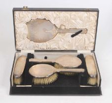 A George V silver five-piece dressing table set, London 1935, cased