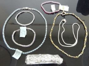 A collection of silver and semi-precious set bracelets, bangles, and necklaces, many as retailed