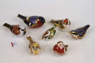 A collection of seven Royal Crown Derby models of birds, to include a yellowhammer, royal robin,