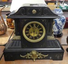 A Victorian black slate eight-day mantel clock, of architectural form, the chapter ring showing