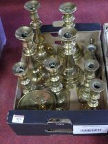 A collection of brassware to include Victorian brass table candlesticks