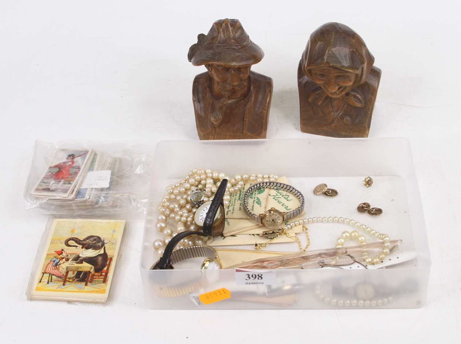 A collection of miscellaneous items to include a pair of softwood book-ends, each carved as a male
