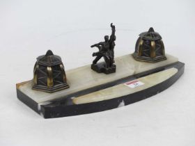 A Soviet Art Deco desk stand, mounted with bronzed metal couple holding a hammer & sickle, and