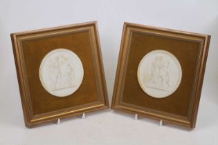 A pair of Royal Copenhagen bisque porcelain roundels, each relief decorated with classical style