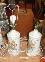 A pair of 20th century floral decorated pottery table lamps, each h.35cm