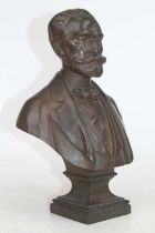 A bronzed metal bust of a gentleman, signed Bulio to the reverse, h.31cm