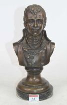 A bronzed metal bust of a gentleman, upon a socle base and black hardstone plinth, h.30cm Of