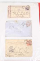 A collection of mid Victorian and later postcards, postmarks including penny red stamps in plastic