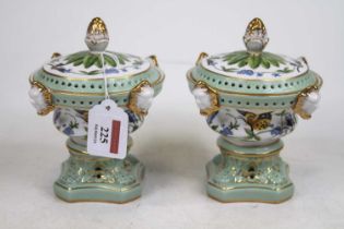 A pair of continental style porcelain pot pourri, each decorated with insects and flowers, h.15cm Of