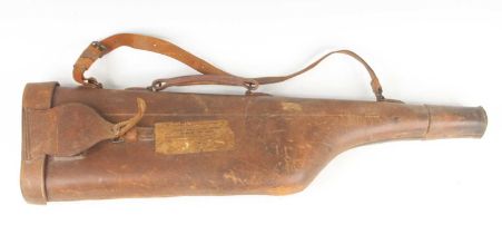 An early 20th century brown leather leg o'mutton shotgun case, having brass fitting and green felt