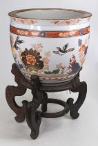 A Chinese export fish bowl of typical form, the exterior decorated in the Imari palette with birds