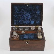 A Victorian rosewood and mother of pearl inlaid vanity box, having later glass jars, some with