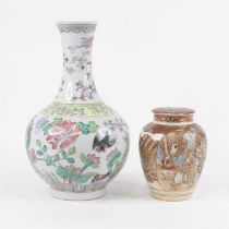 A Chinese export vase having a flared rim to a slender neck and bulbous lower body, enamel decorated