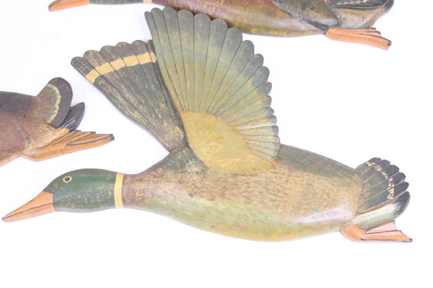 A set of four carved and painted pine wall plaques, each in the form of a flying duck One has been - Image 2 of 3