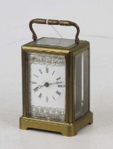 An early 20th century lacquered brass cased carriage clock, having visible platform escapement,