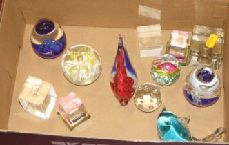 A collection of art glass paperweights, to include an example modelled as a fish