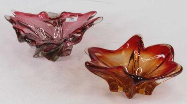 A cranberry tinted art glass dish, of abstract triangular shape, w.25cm; together with another