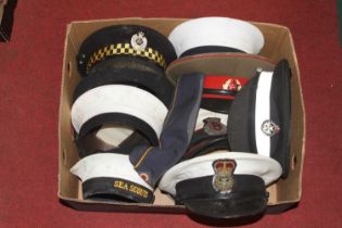A collection of military, naval and police caps