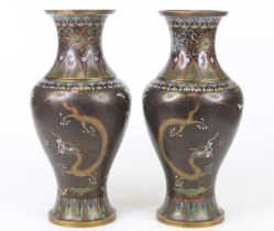 A pair of Chinese cloisonne enamel vases, each decorated with a dragon and chrysanthemums, each h.